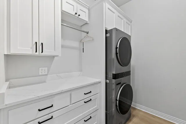 Laundry — quartz counter, washer/dryer tower
